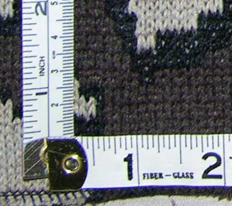 The Knit Tree's Camo fabric is 10.5 stiches per inche and 10.5 visual rows per inch
