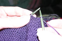 Once again there is ONE stitch on the right hand knitting needle.