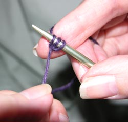 Gently pull the free end of yarn with the left hand to tighten the stitch which was just cast on.