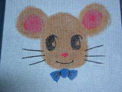 The Painting of Anime Mister Mouse has to dry before assembling the knit baby sweater. 