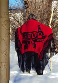 Carver, Peter Paylor wearing a handloomed Wolf dance shawl, back view 